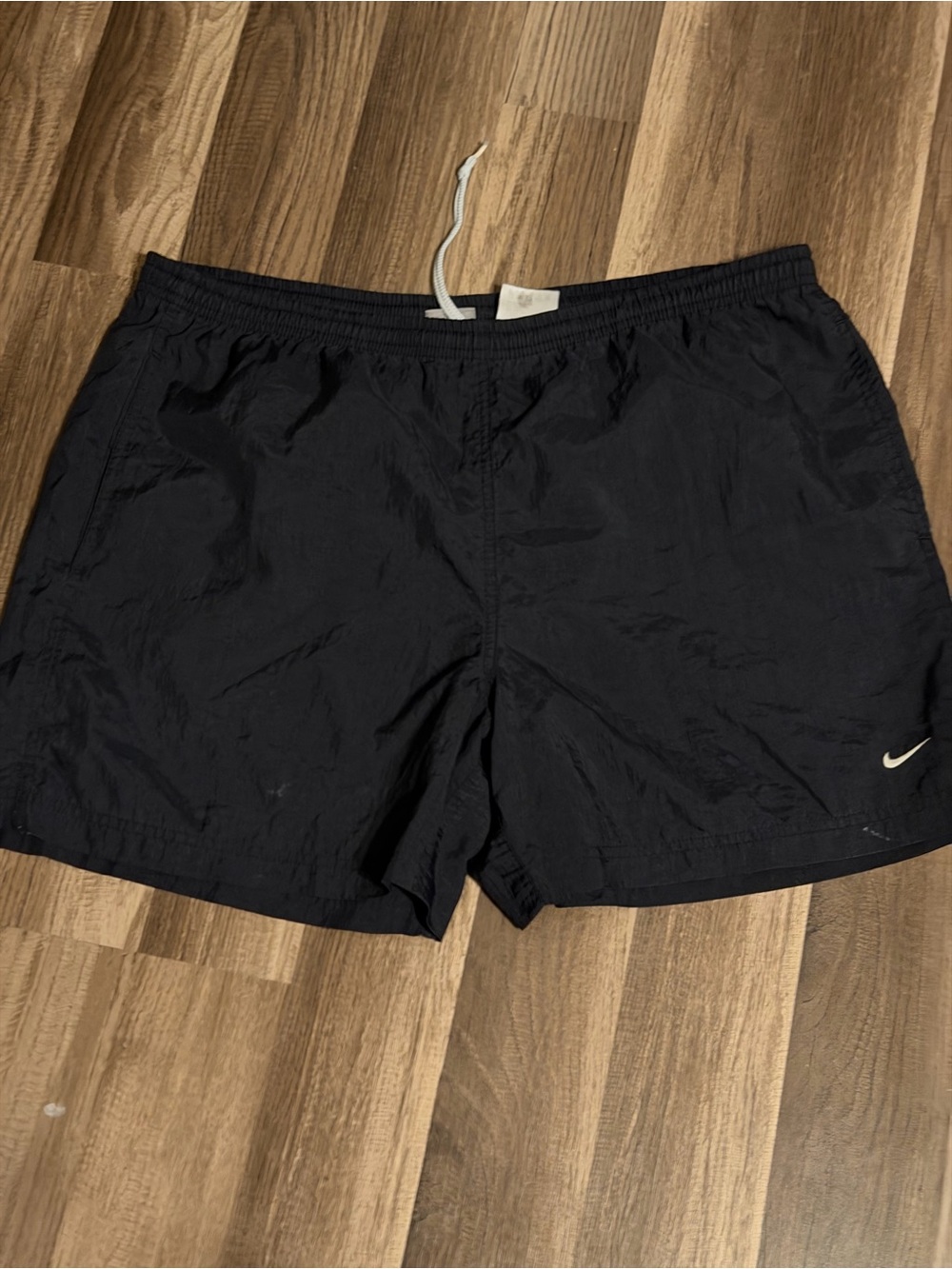 Nike Kids Black Swim Trunks with White Swoosh